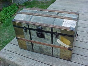 Metal covered antique trunk