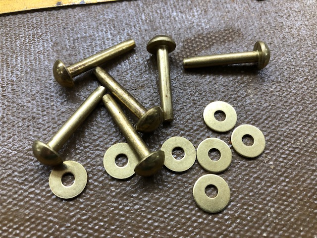 9 domed brass rivets and burrs sold by the pound