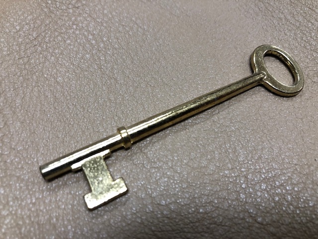 brass skeleton key, door key