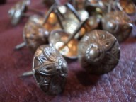 Decorative tacks for antique trunk repair and refinishing