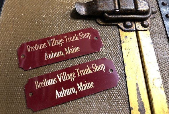 Metal trunk tags with trunk maker name