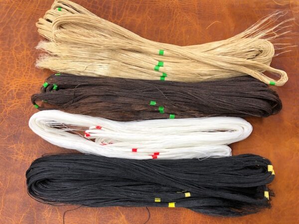 hand sewing threads in four colors