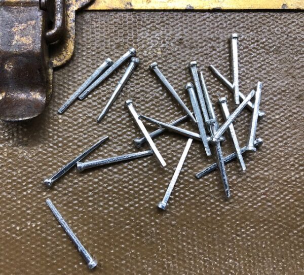 Straight nails with small heads are useful for steamer trunk repair