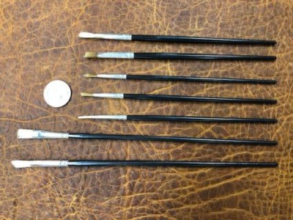 Set of seven small paint brushes for detailed painting or staining