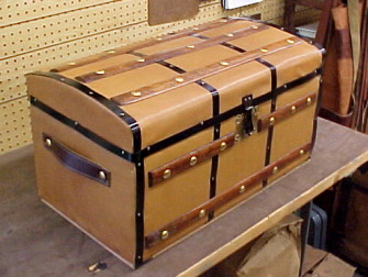 Large brown, wooden trunk before restoration 