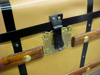 close up buckle on wooden trunk