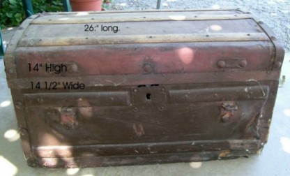 Large brown, wooden trunk before restoration 